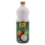 Coconut milk in a can from Real Thai, rich and creamy Thai grocery product with a smooth white liquid inside