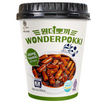 Wonderpokki Jjajang Topokki in a grocery package, showcasing spicy Korean rice cakes with black bean sauce from Wonderpokki brand.