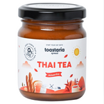 Toastaria Thai Tea box with packaging featuring Thai tea leaves and branding, set against a plain background.