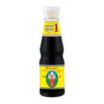 Deksomboon Thin Soy Sauce 95ml bottle, traditional Thai dry grocery condiment with clear liquid and label, in a clear glass bottle