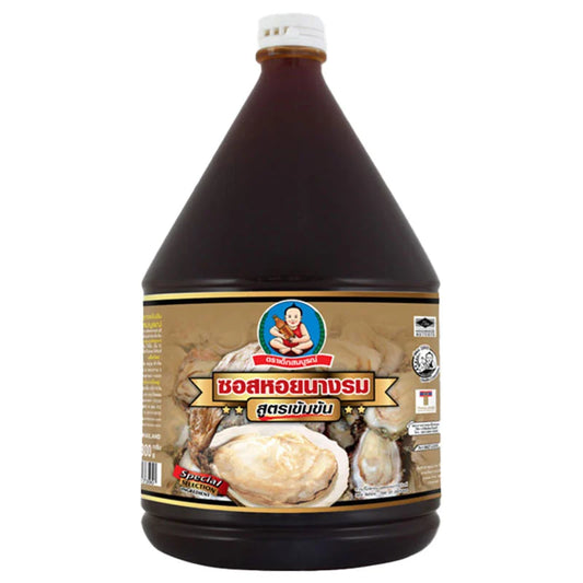 Thick oyster sauce by DEK SOM BOON in a 2.3 kg jar, showing glossy, rich sauce with oyster chunks inside.