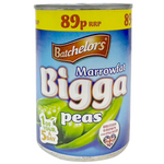 Cans of Batchelors Bigga Peas in a grocery store display, showing the product label and colorful packaging.