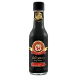 Deksomboon Premium Soy Sauce 250ml bottle, rich dark liquid for cooking, in a clear glass bottle with a label.