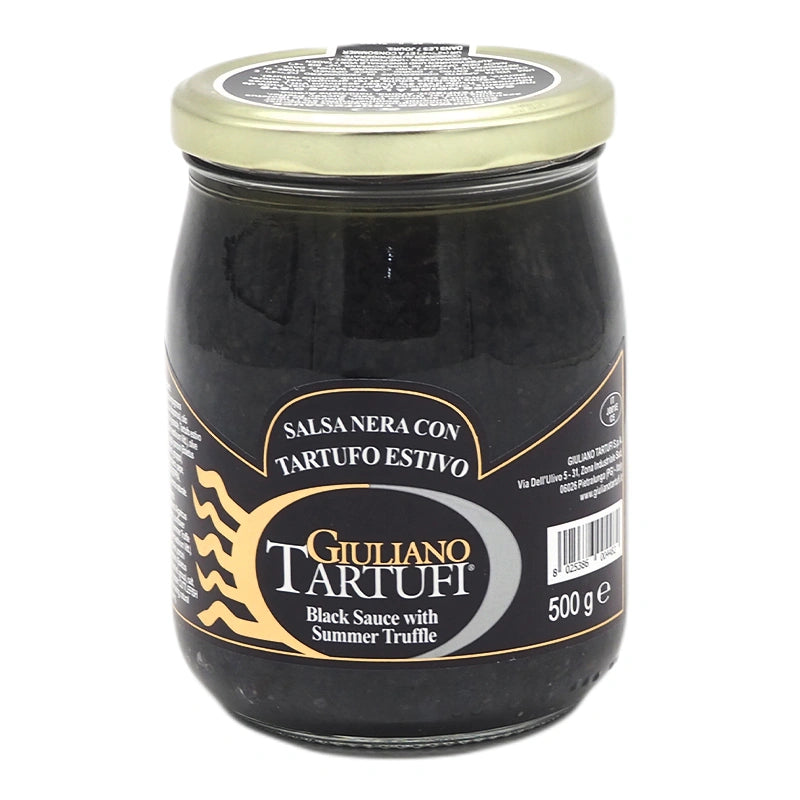 Jar of GIULIANO TARTUFI Black Truffle Sauce, 500 g, with dark truffle pieces visible in a rich, savory sauce.
