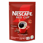 Nescafe Red Cup Coffee drink in a clear glass, showcasing its rich, dark coffee color and inviting aroma.