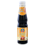Healthy Boy Sweet Soy Sauce bottle, a popular grocery item, with dark, glossy soy sauce in a clear glass bottle.
