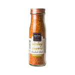 Ground chilli spice from Spice Story, showcasing vibrant red chili powder in a clear container for flavorful cooking.