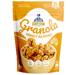 Captain Oats Honey Almond Granola in a bowl with honey and almonds, showing the crunchy texture and golden color.