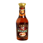 Thai Longan Honey in a jar, natural grocery product from Thai brand, showcasing golden honey with a smooth texture.
