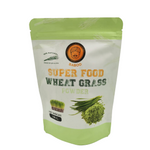 Organic Baboo Wheat Grass snack in a clear package, highlighting healthy, raw confectionery with vibrant green wheat grass.