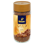 Tchibo Gold Selection instant coffee drink in a cup with a spoon, showcasing rich, aromatic coffee from the Tchibo brand.