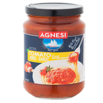 Jar of Agnesi Pasta Sauce Garlic with visible label, showcasing creamy garlic sauce for pasta dishes.
