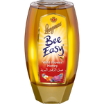 Jar of Langnese Bee Easy Bjenhoing honey in a glass container with a golden honeycomb pattern label.