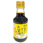 Tamago brand Tamago Ni Kakeru Oshoyu soy sauce bottle, traditional Japanese grocery condiment with a black label and orange cap