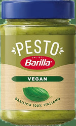 Barilla Pesto Basilico Vegan jar showing fresh basil leaves and pesto sauce, ideal for healthy, plant-based meals.
