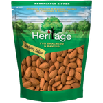 Heritage Raw Natural Whole Almonds in a clear bowl, showcasing their light brown, textured shells, perfect for healthy snack options.