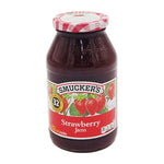 Smucker's strawberry preserves jar showing vibrant red strawberry spread in 907g jar on a white background.