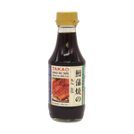 Takao Unagi Sauce in a bottle, used for Japanese cuisine, with a dark, glossy appearance and label showing Takao brand.