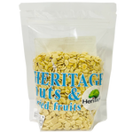 Heritage roasted salted melon seeds in a bowl, close-up view of the crunchy snack in a clear container.