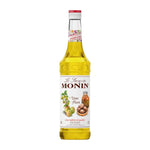 Bottle of MONIN Ume Plum Syrup in 700ml size, showcasing the dark-colored syrup in a clear plastic bottle.
