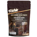 Richie dark brown cocoa powder for drinks, shown in a container with a rich, chocolatey appearance and smooth texture.