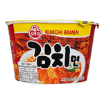 Ottogi Kimchi Ramen bowl with steaming hot ramen, slices of kimchi, and garnishes in a ceramic bowl.