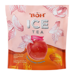 Boh Ice Tea Peach drink in a clear glass bottle with a peach and tea leaves, showcasing a refreshing peach-flavored ice tea.