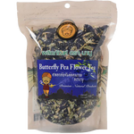 Glass of Baboo Butterfly Pea Flower Tea showing vibrant purple color and fresh flower petals floating on top.