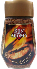Bon Aroma Gold Coffee drink in a glass cup, showcasing rich dark coffee with a frothy top.