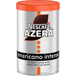 Nescafe Azera Americano Intense coffee drink in a glass mug with dark coffee and a frothy top.