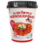 Spicy Wonderpokki Topokki in a bowl, showcasing chewy rice cakes and spicy red sauce, packaged for quick Korean snack enjoyment.