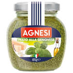 Jar of Agnesi Alla Genovese Pesto Sauce showing the label and fresh basil ingredients on a grocery store shelf.