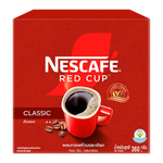 A steaming cup of Nescafe Red Cup coffee on a saucer, showcasing the iconic red branding and rich, dark coffee inside.