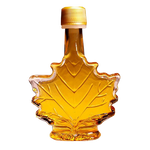 Turkey Hill 100% maple syrup bottle with golden syrup pouring from a spout, labeled for grocery use.