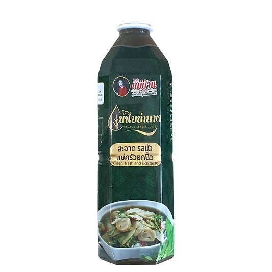 Makro Yanang Leaves Juice in a clear glass bottle, showcasing fresh green leaves and natural liquid ready for consumption.