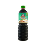 Deksomboon Seasoning Sauce bottle from dry grocery, featuring clear label and dark liquid inside.