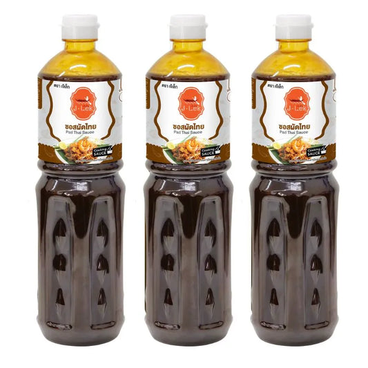 J-LEK Pad Thai sauce bottles, 1150g each, pack of 3, featuring rich, flavorful Thai-style sauce in clear bottles.