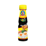Deksomboon Seasoning Sauce 150ml bottle, visible label, used for flavoring in cooking, in a dry grocery setting