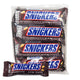 Four SNICKERS chocolate bars, 35g each, displayed together with their distinctive packaging and logo visible.