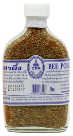 Tpa Bee Pollen in a jar, natural grocery supplement with golden bee pollen granules, used for health and wellness.