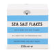 OLSSON Sea Salt Flakes Cube 250G, close-up of flaky sea salt in a clear cube-shaped container, highlighting its texture and natural appearance.